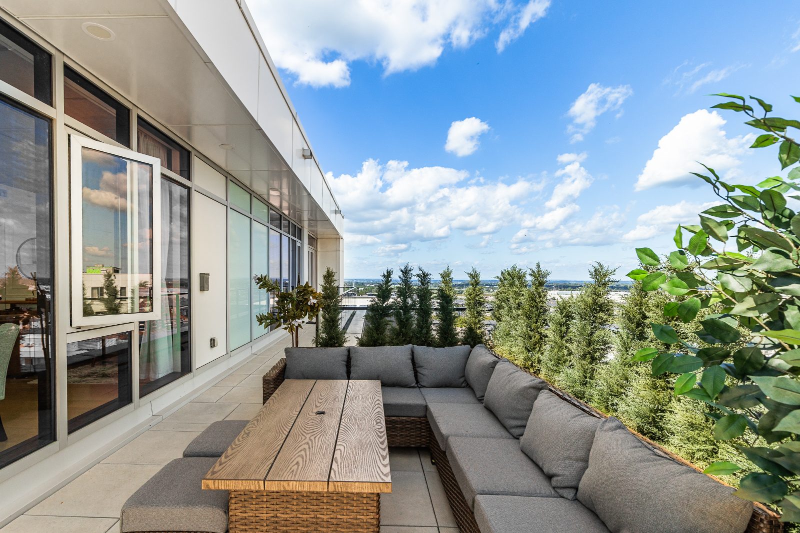 Furnished private terrace with outdoor lounge and open city views