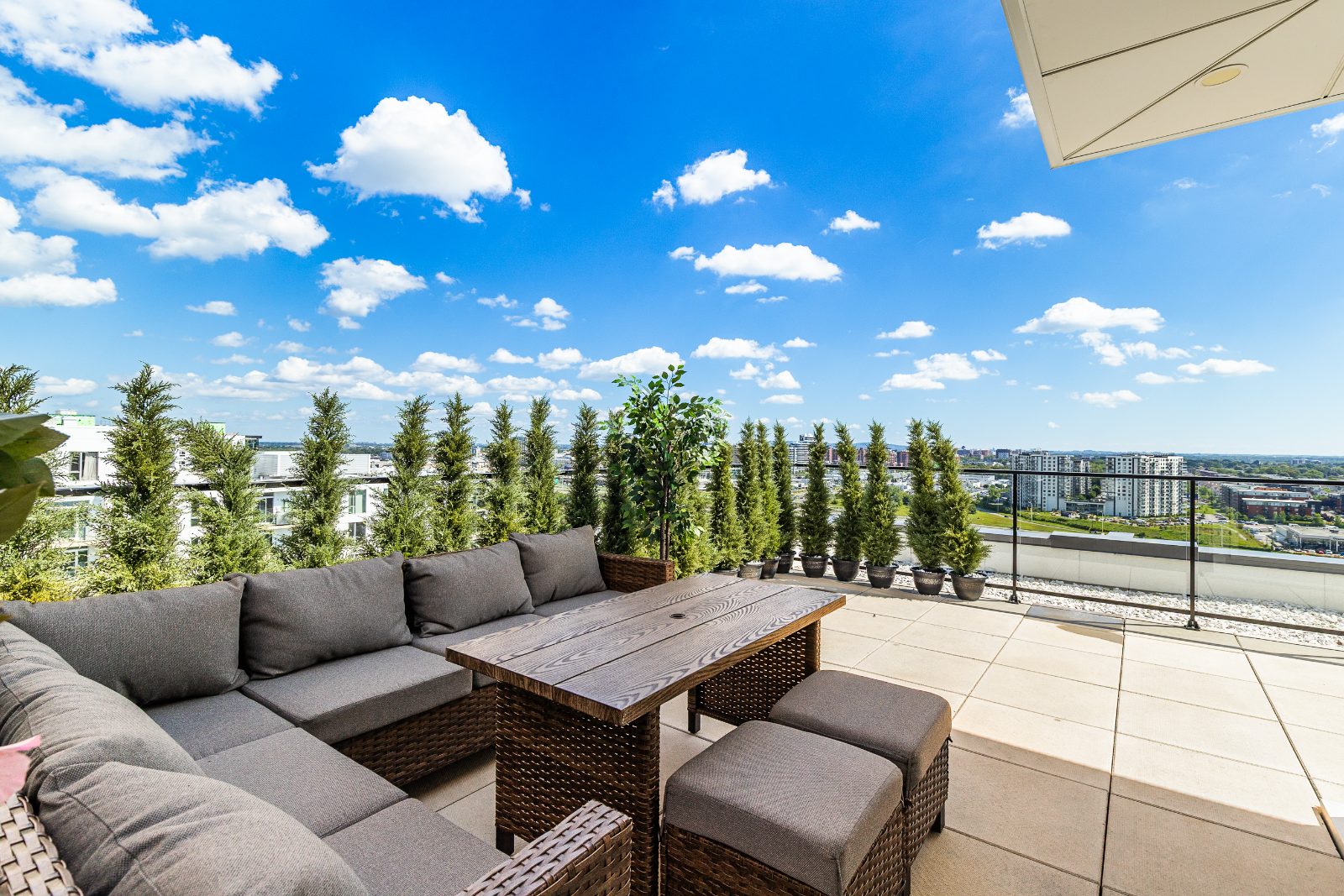 Terrace relaxation corner with outdoor sofas and plants