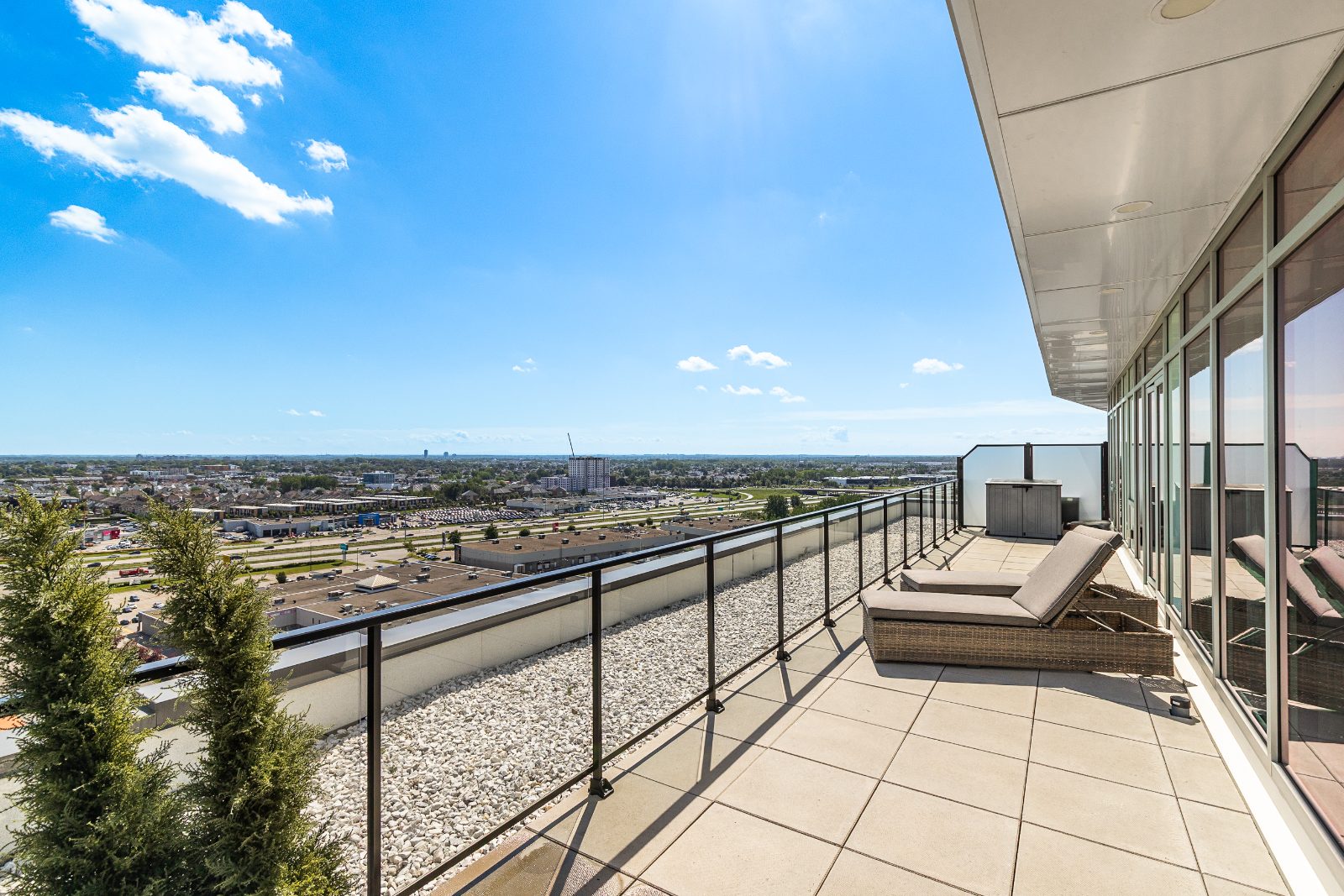 Long rooftop terrace with views over Laval
